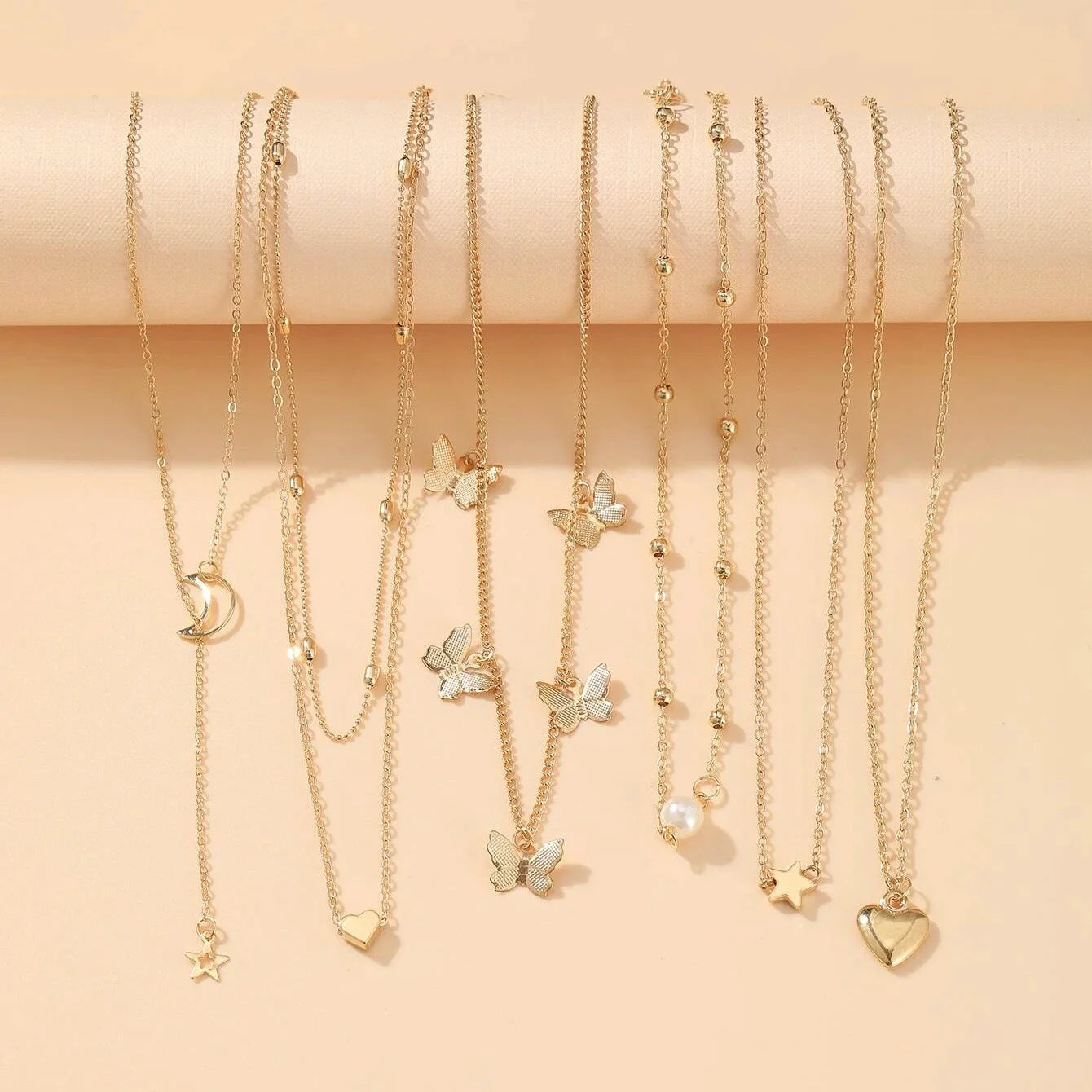 Chic Vintage Gold Jewelry Set: Stunning Pendant Necklace, Twisted C-Hoop Earrings, Elegant Rings & Bracelet for Everyday Glam!